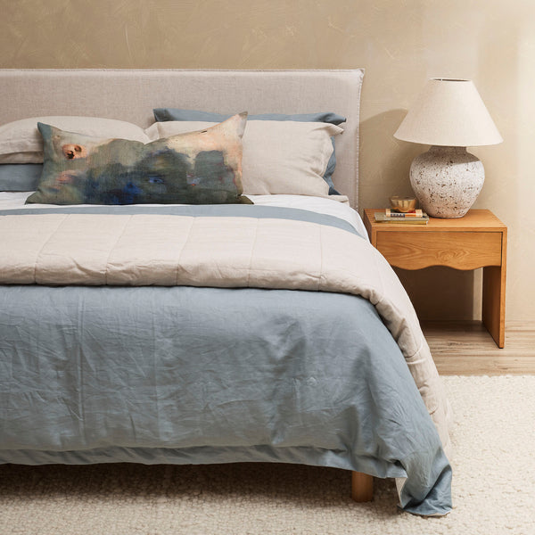 Thread Design Cosmic Ocean Lumbar Cushion on ocean bed linen