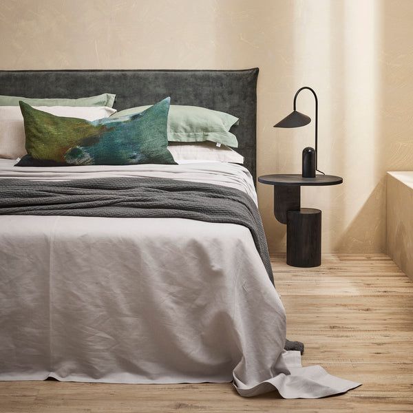 Thread Design Deep Dusk Lumbar Cushion on bed