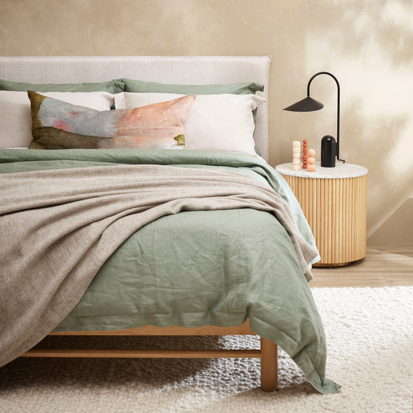Thread Design Gentle Dawn Lumbar Linen Cushion with sage bed linen