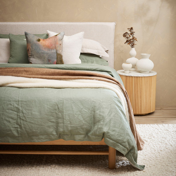 Thread Design Gentle Dawn Linen Cushion on sage linen